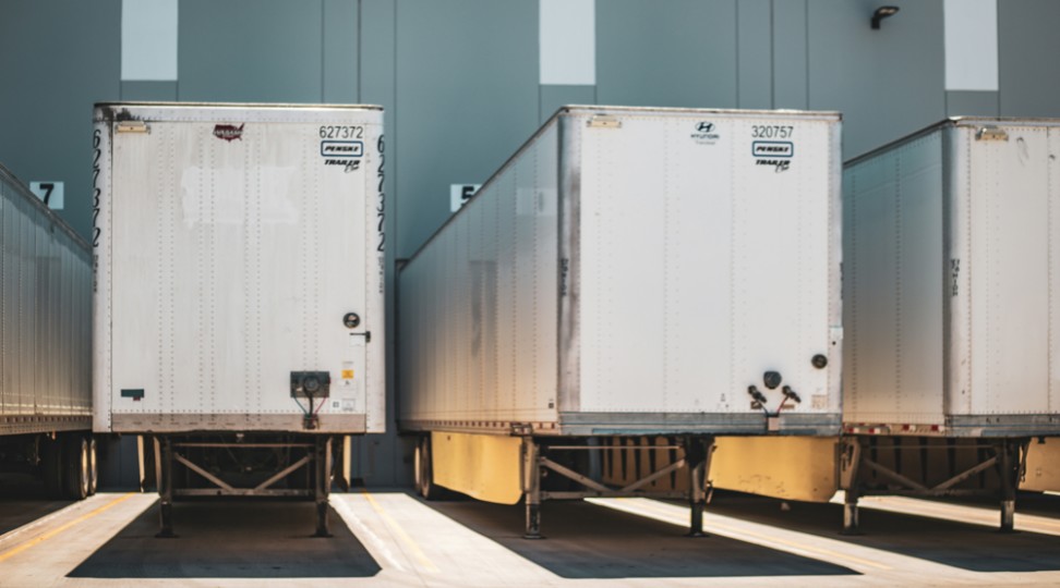 Cross Docking at a Loading Dock Freight trailers positioned at loading bays, showing fast cross docking and outbound transfer.